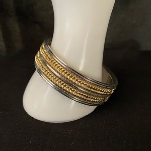 Heavy silver and gold tone metal clamper bracelet
